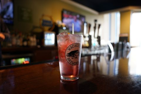 A tall drink on the Westborough bar, taps behind