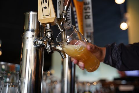 A draft beer pouring from the tap at Westborough